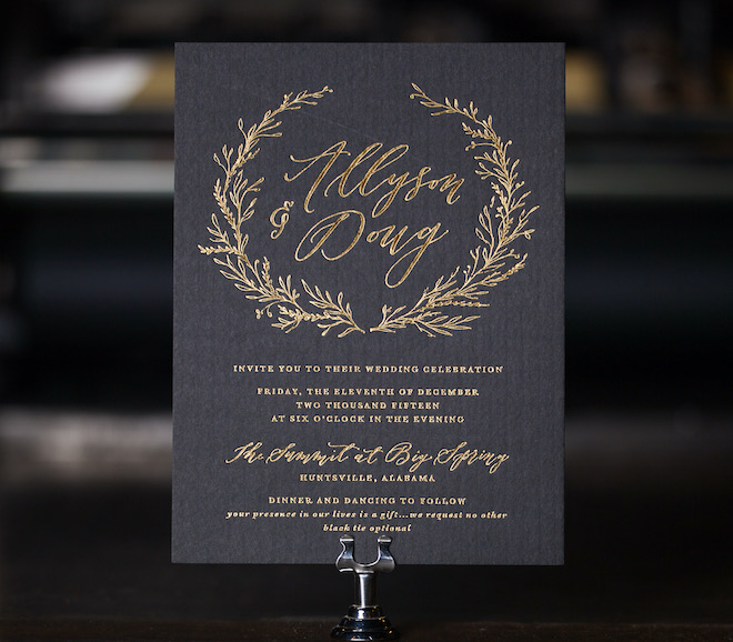 A wedding invitation with hot stamp gold foil.