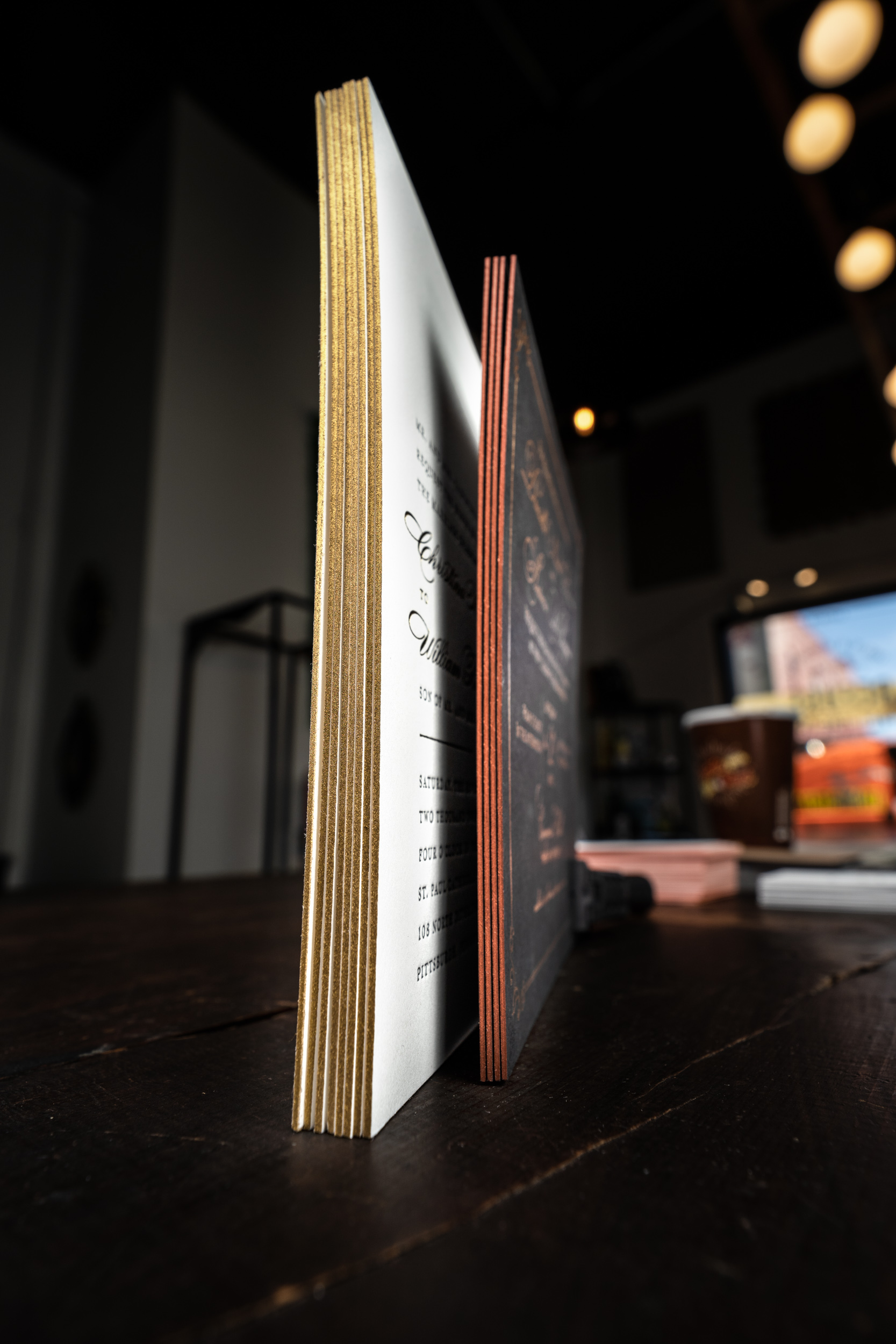 Letterpress invitations with edge painting.