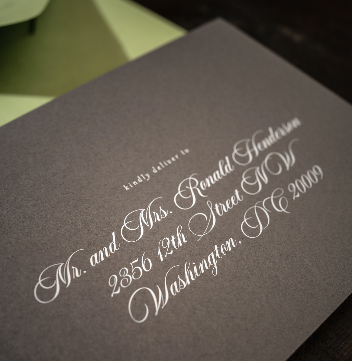 A close up of guest addressing on an envelope.