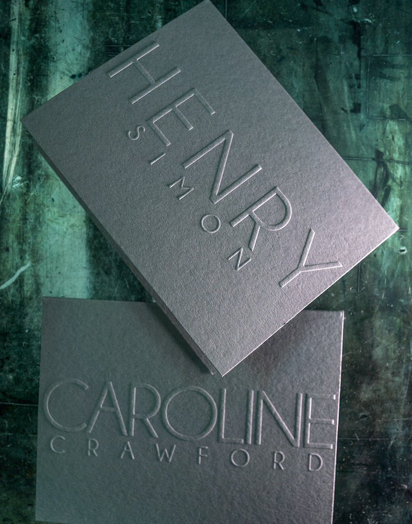 A business card with embossed printing.