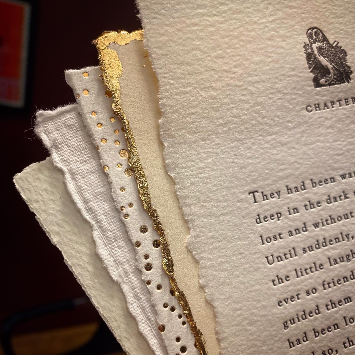 A stack various types of deckled edge paper.