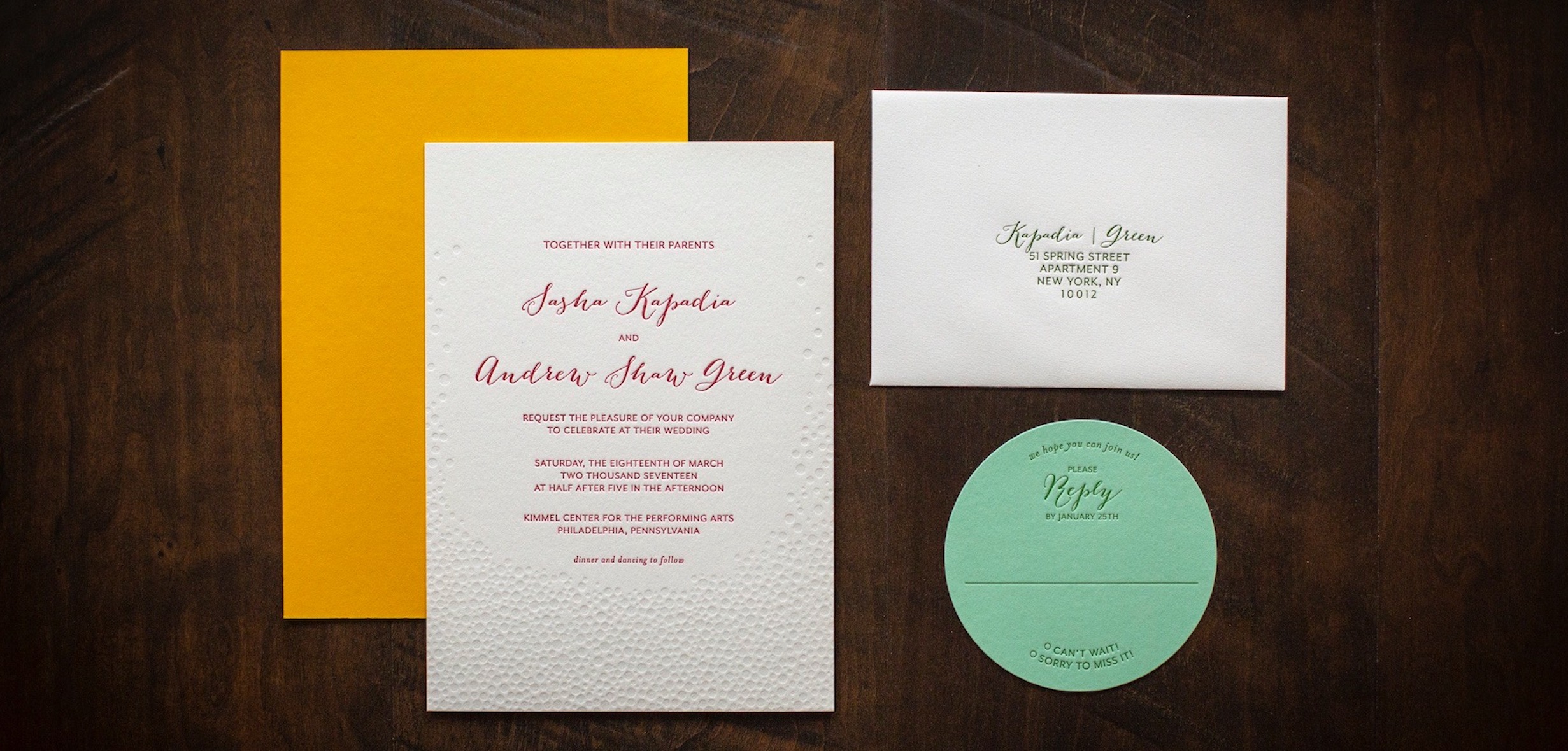 A letterpress printed wedding invitation suite.
